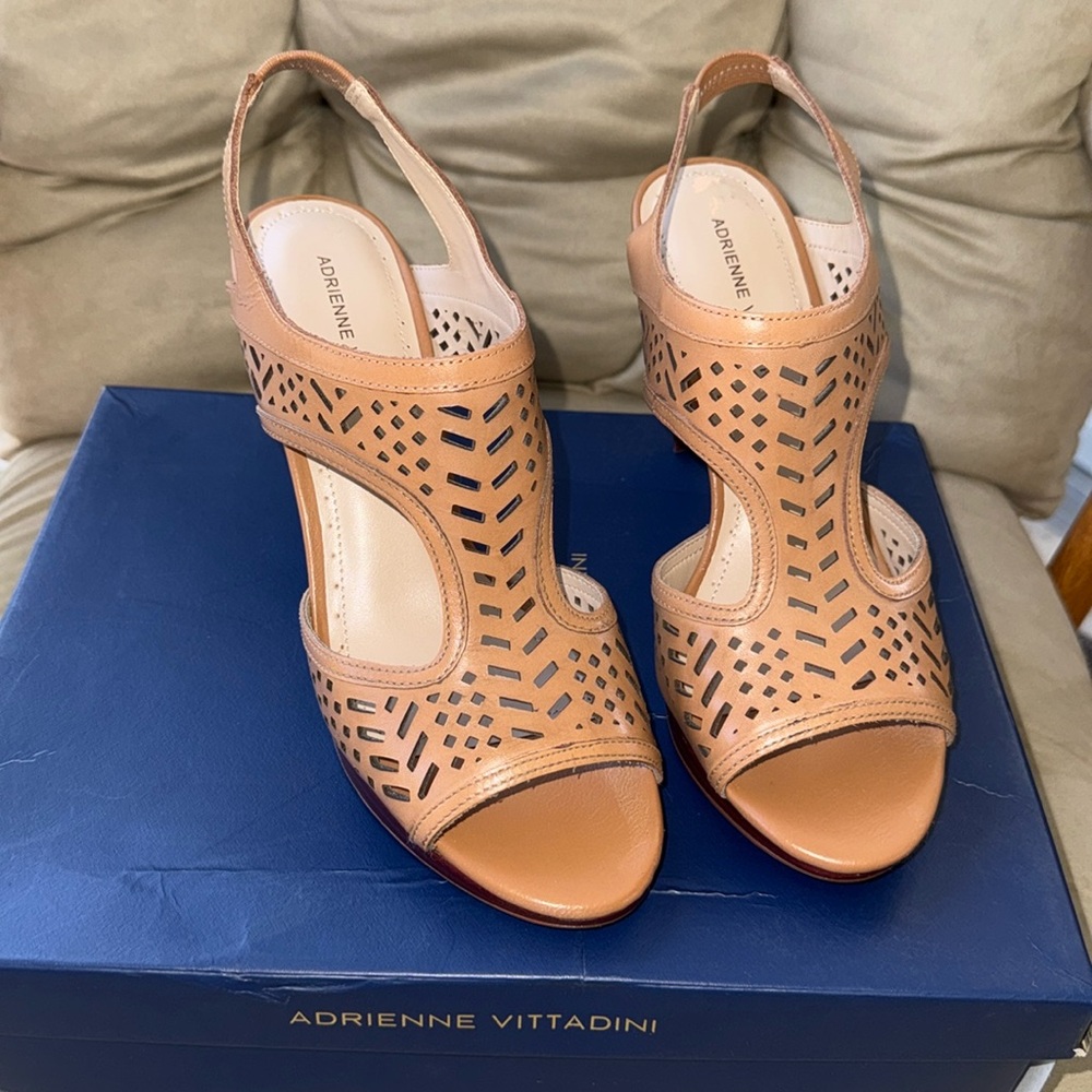 New in box with small damage from moving see pics. Leather platform slingback
